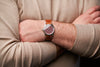 Shot of the Oak & Oscar Olmsted FEW limited edition on wrist on male with tan color sweater