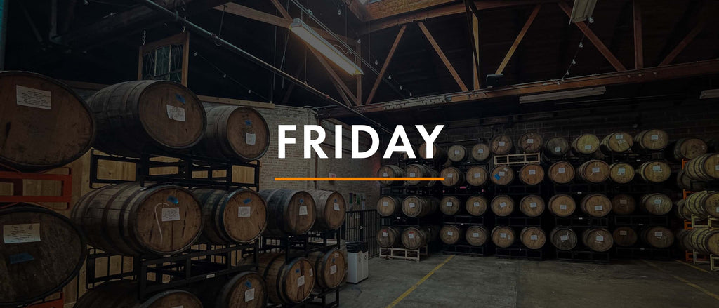 Barrel room at Half Acre. Racks of barrels in warehouse.