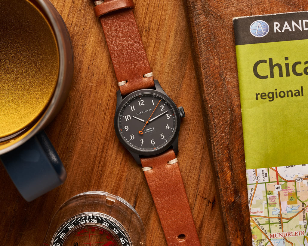The Olmsted Watch in matte black with a leather watch strap