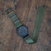 The Olsmsted Matte watch with a green band