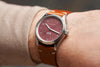 Shot of the Oak & Oscar Olmsted FEW limited edition on wrist on male with tan color sweater